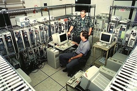 Authors Forrest Hoffman (standing) and Bill Hargrove sit 'inside' the computer they constructed from commodity PCs.